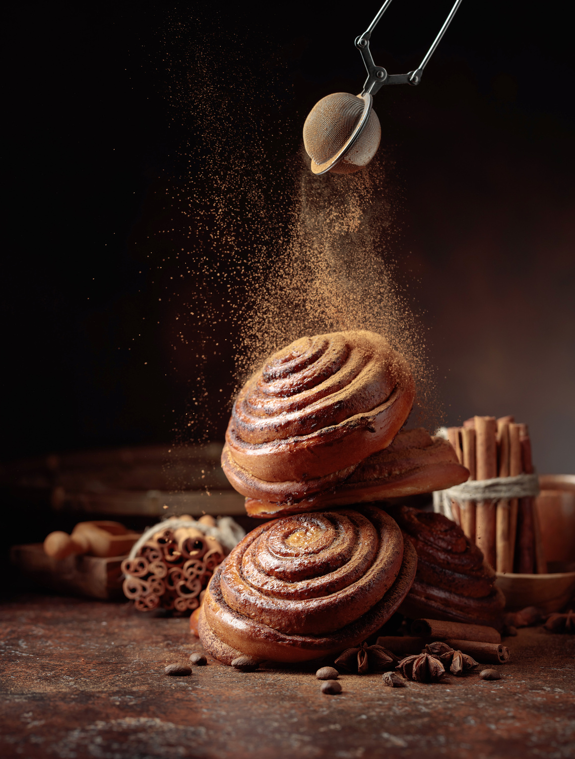 Buns sprinkled with cinnamon powder.